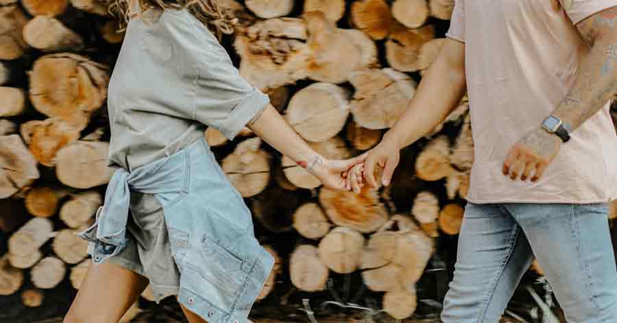 couple walking while holding hands