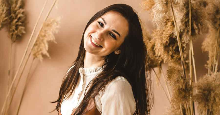 woman sitting and smiling at the camera