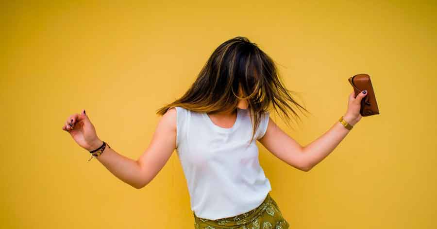 woman dancing with yellow background